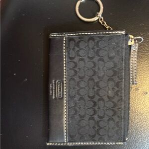 Coach Signature black slim card case with a key ring.